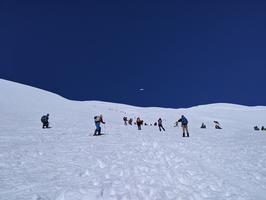 First time I have ever seen someone parachute down a mountain! Most people skied down the mountain.