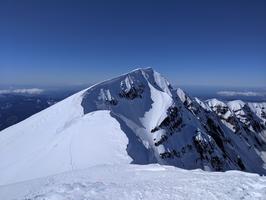 Once you get to the top of that hill, you can see the true summit. If you look closely, you can see the heads of two climbers on the top.