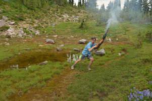 David realized the best way to put out the fire was to just put the log in a nearby pond.