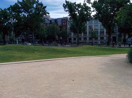 Youths playing soccer at a public park on Bastille Day.